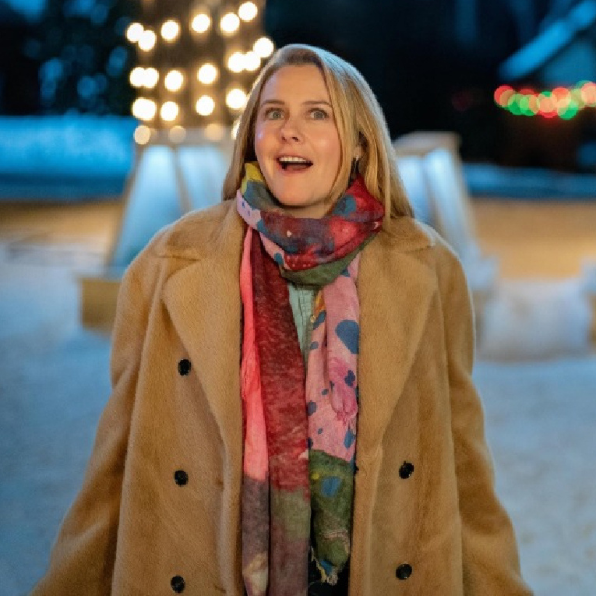 Alicia Silverstone wearing camel brown double-breasted shearling long coat in A Merry Little Ex-Mas 2025