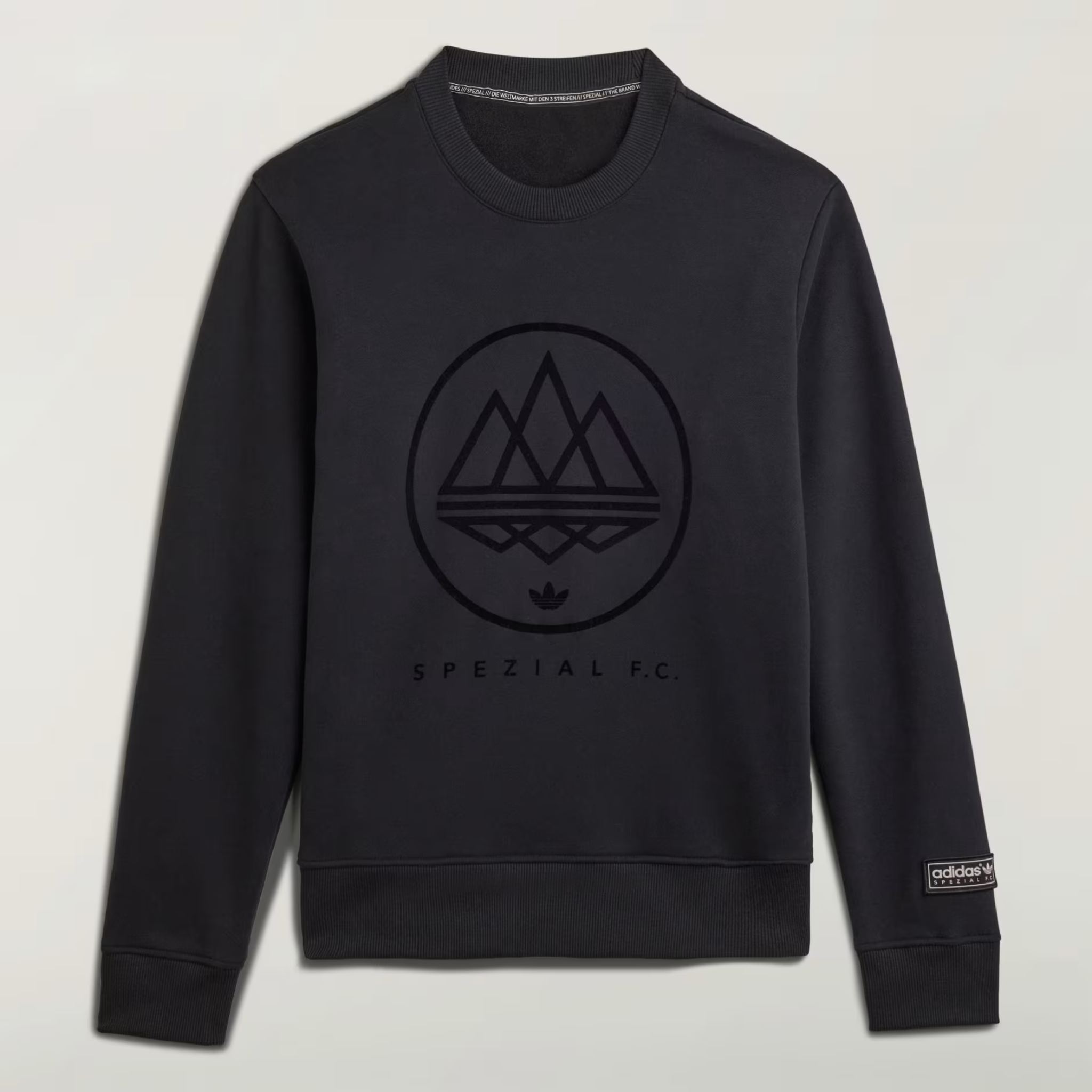 Unisex black crewneck sweatshirt featuring Adidas Spezial F.C. mountain emblem