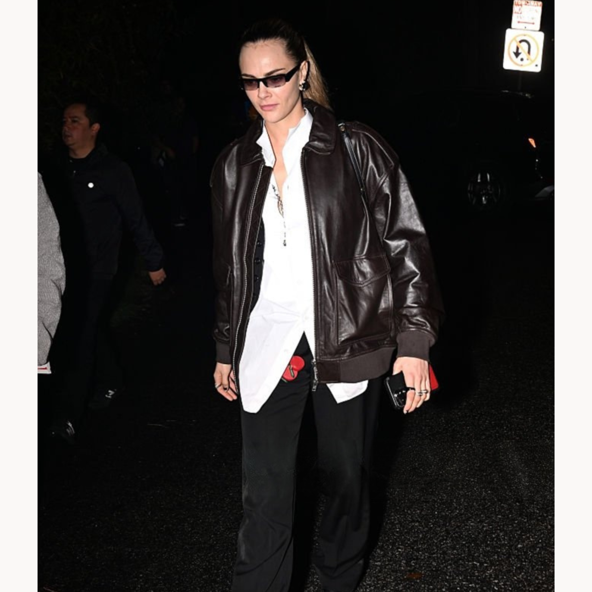 Celebrity-inspired oversized brown leather bomber jacket worn by Cara Delevingne