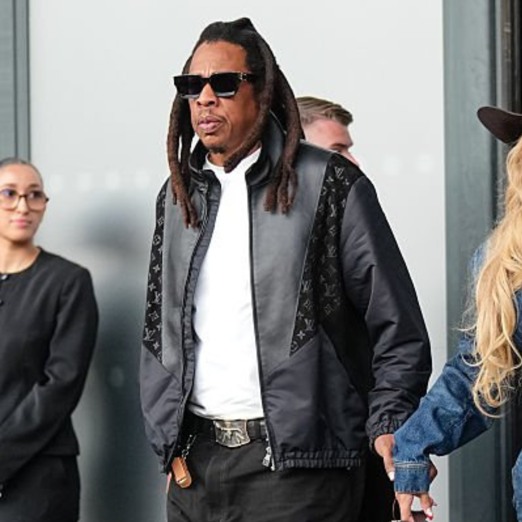 Jay-Z wearing black Louis Vuitton monogram panel bomber jacket at Paris Fashion Week 2025
