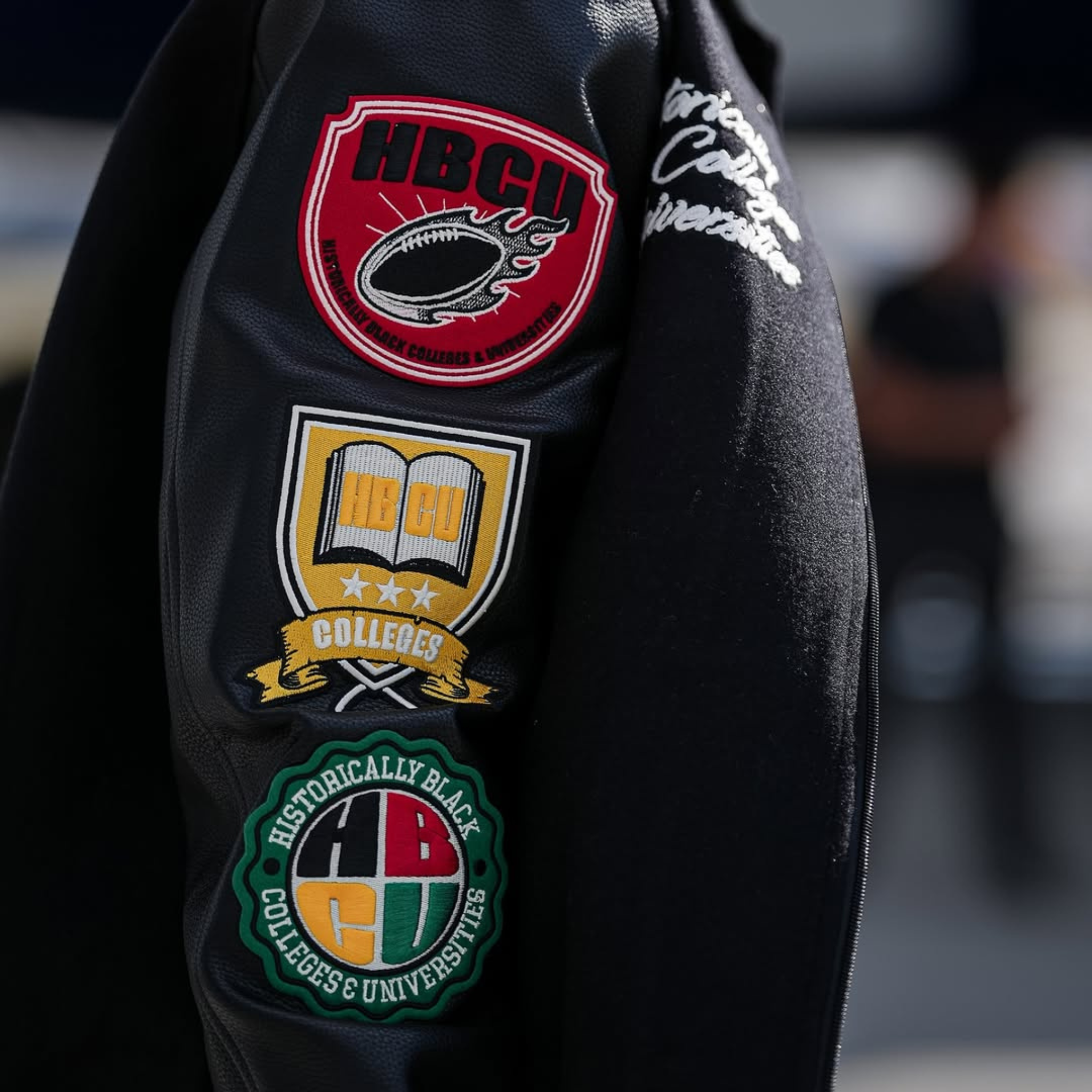 Celebrity-inspired KhaDarel Hodge black varsity jacket featuring red and gold details