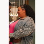 Destiny wearing a distressed denim jacket with pearl stud sleeves in Loot Season 3 Episode 6