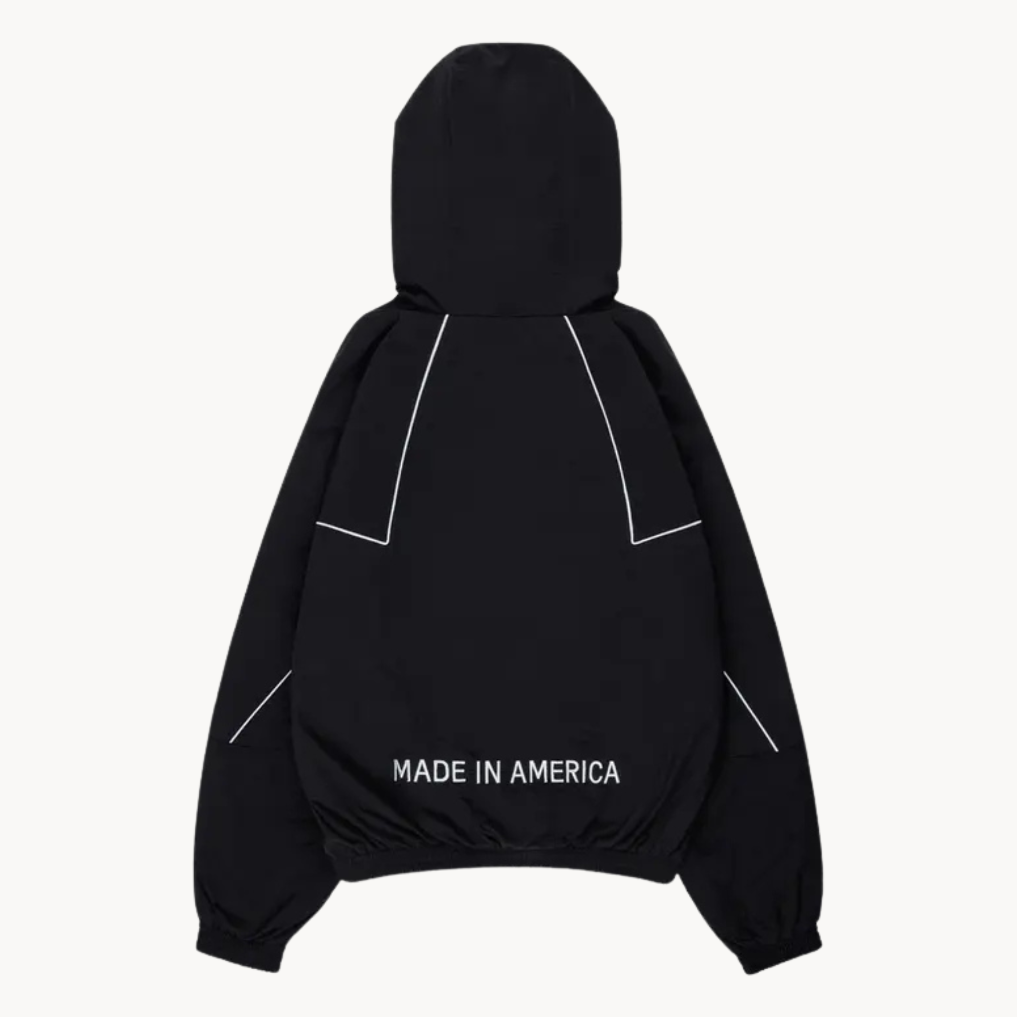 Stylish Marty Supreme full-zip jacket featuring orange star chest graphics and white piping trim in black color.