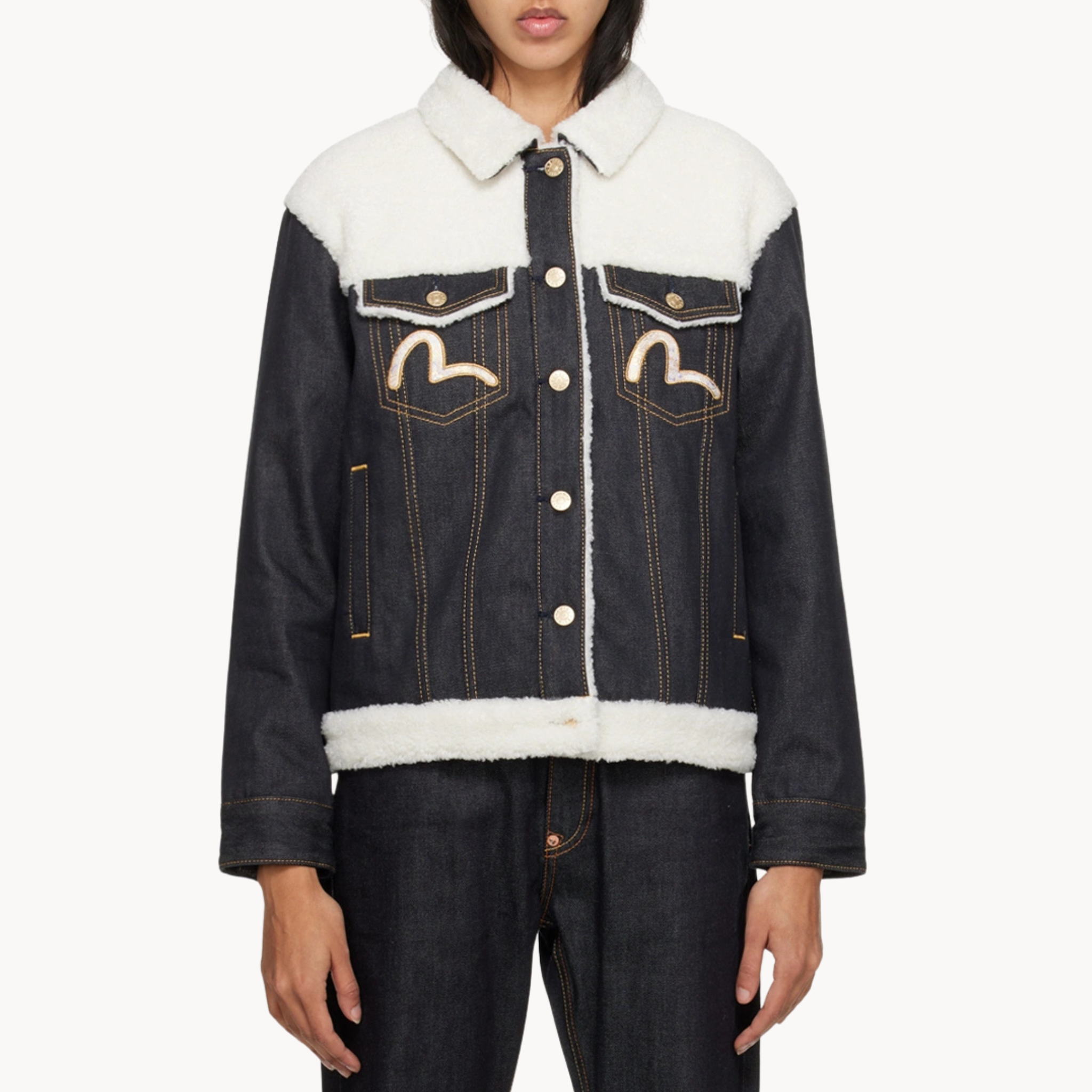 Dark indigo sherpa-lined Evisu trucker denim jacket inspired by Michael Bivins