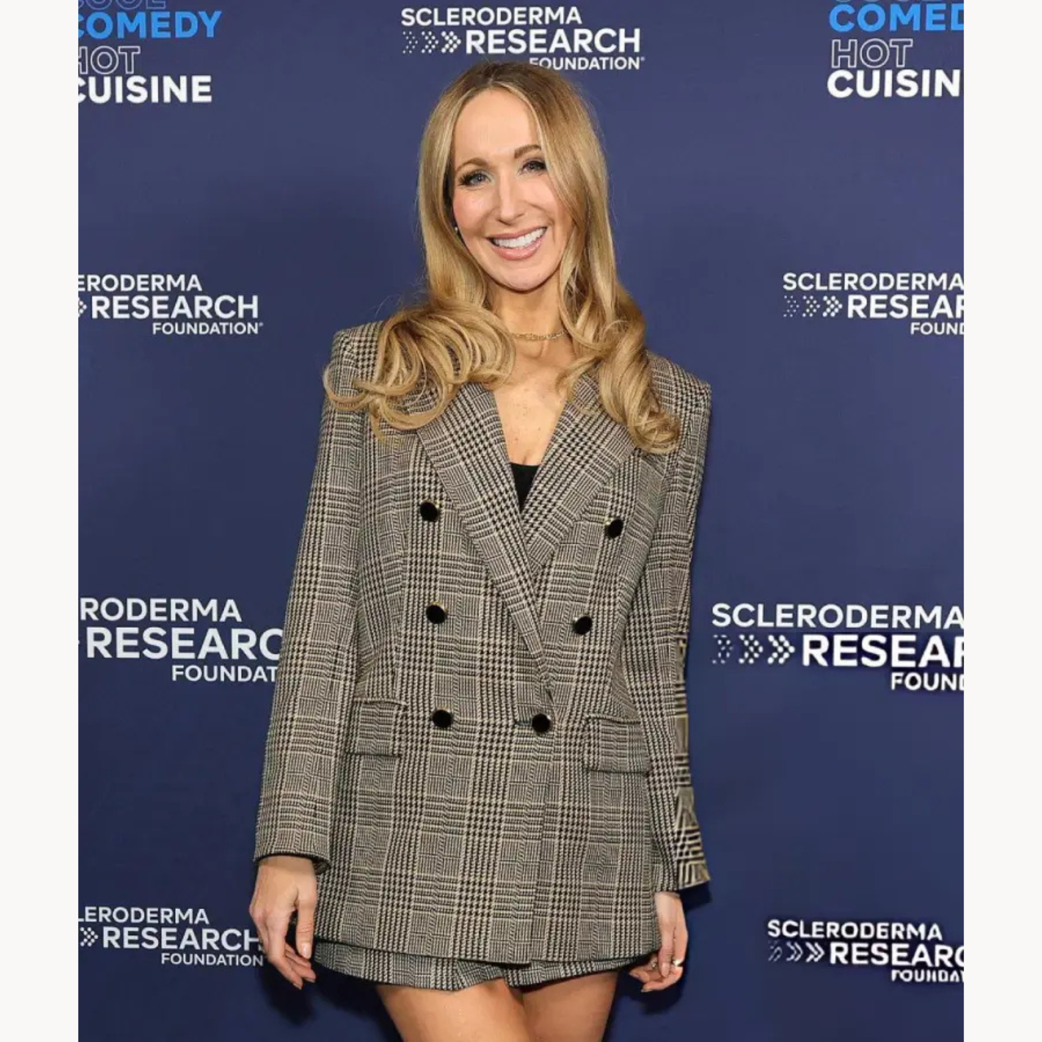 Nikki Glaser wearing a glen plaid double-breasted blazer at the Cool Comedy Hot Cuisine Event