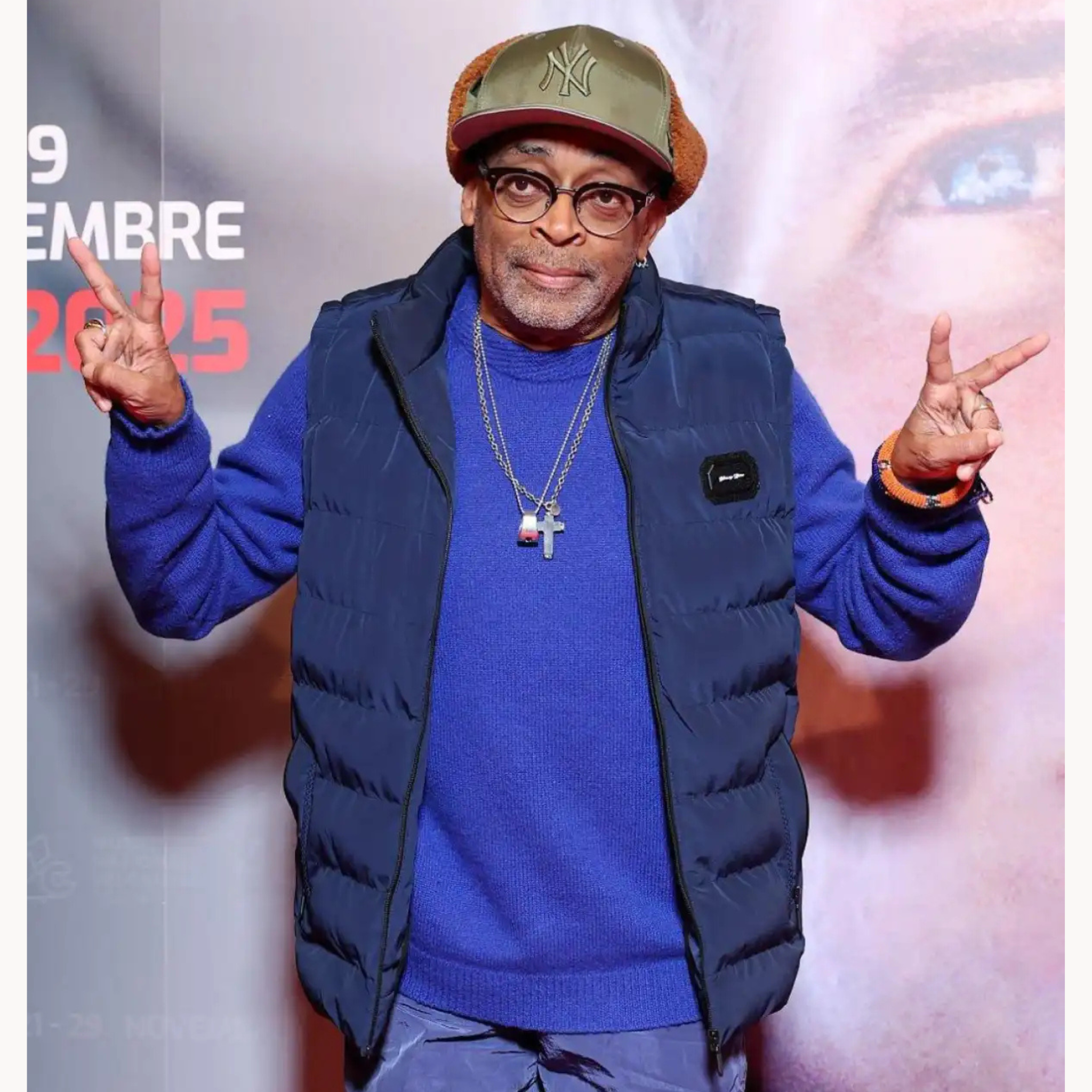 Spike Lee wearing navy blue stand collar quilted puffer vest at 43rd Torino Film Festival 2025