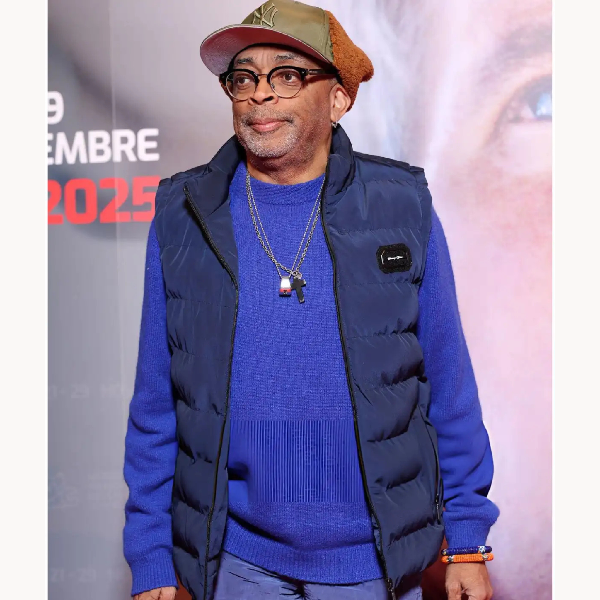 Navy blue quilted puffer vest with stand collar inspired by Spike Lee