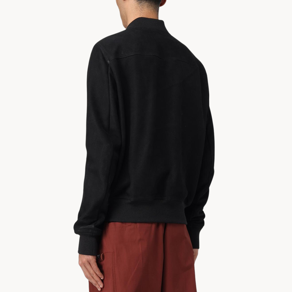 Stylish men’s black zip-up bomber jacket worn by Nick Torres in NCIS