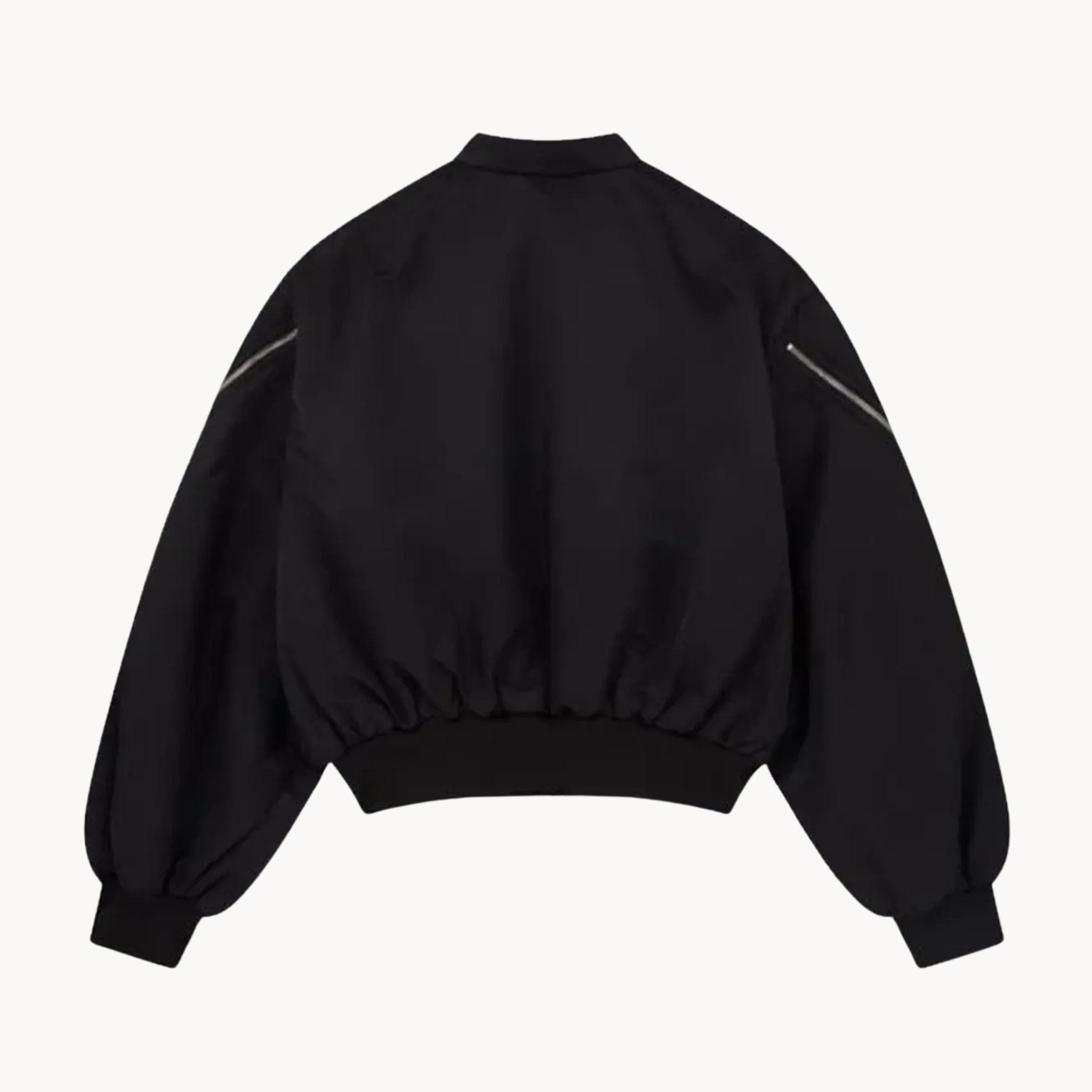 My City Front NY logo cropped bomber jacket in black featuring sleeve zippers, styled in a Timothée Chalamet fashion look.