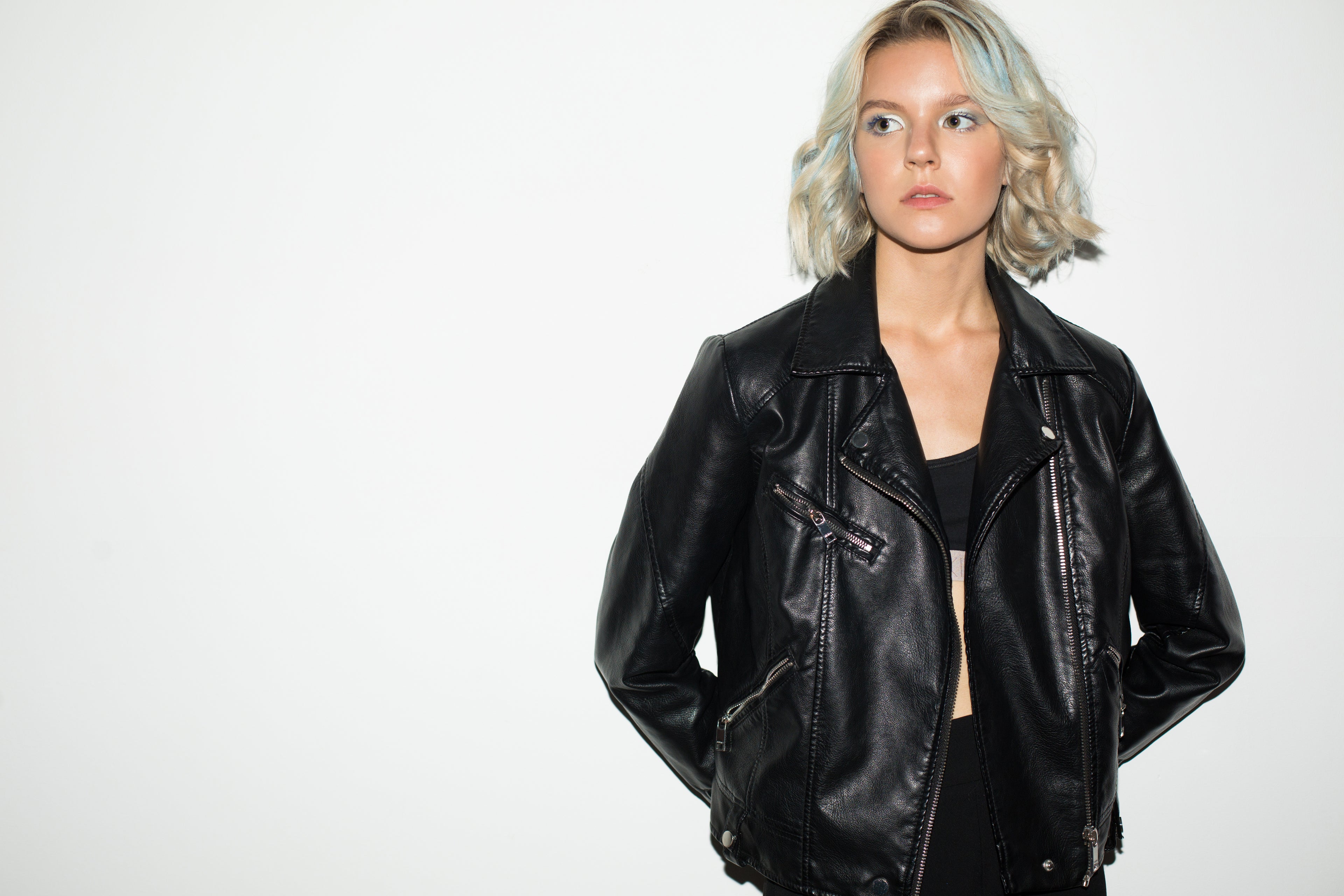 Women's black leather jacket banner highlighting stylish outerwear from Outer Mode